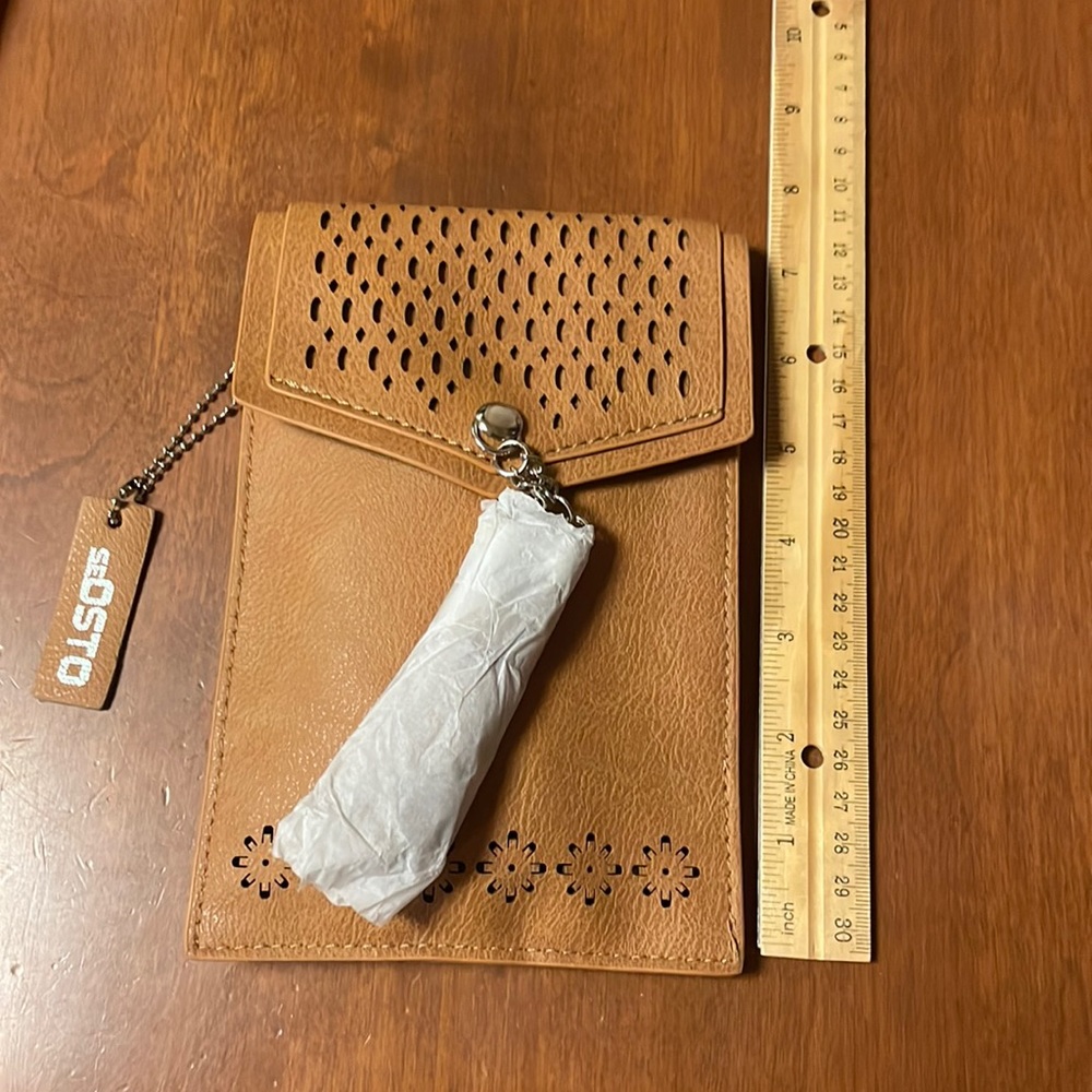 Tan detailed with tassels small crossbody bag. NWT, never used